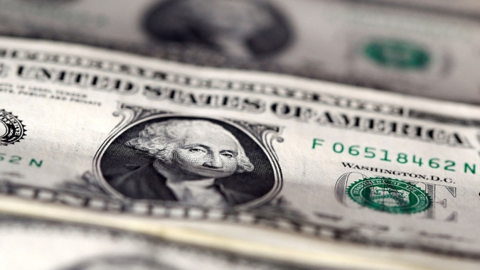 Dólar à vista inicia sessão em baixa de olho no Relatório de Inflação e no exterior