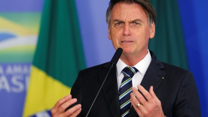Em pronunciamento, Bolsonaro cita OMS e diz que é preciso salvar vidas sem destruir o emprego